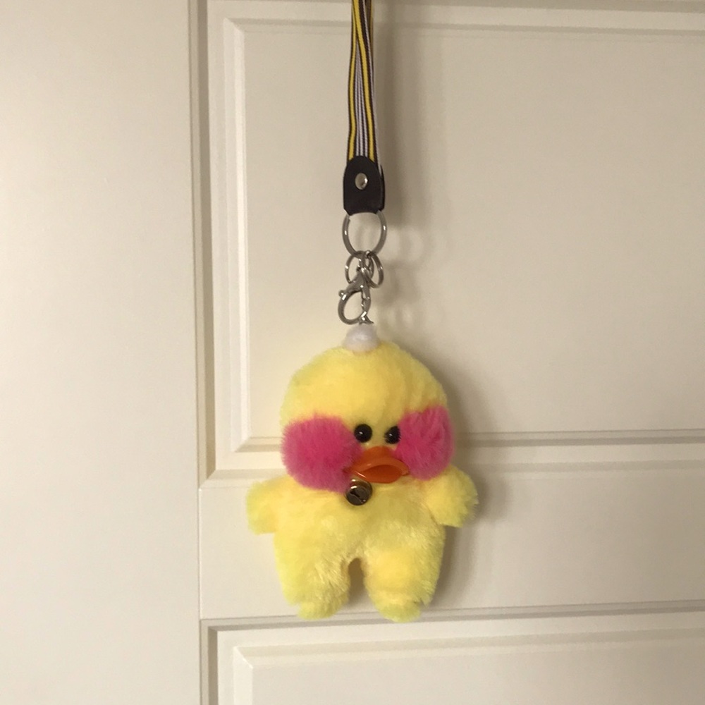 Yellow Lalafanfan Duck plush toy backpack clip.